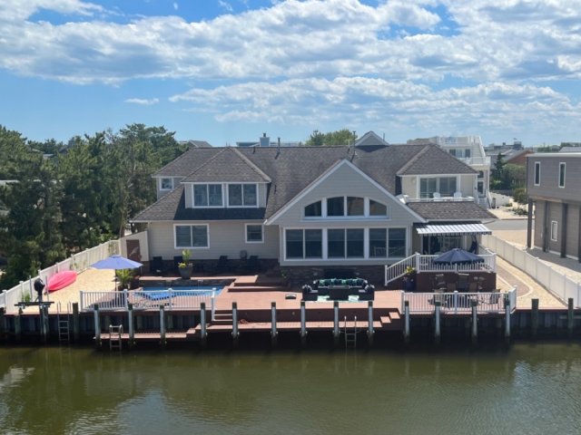 4BR Home w Heated POOL on lagoon w 90’ of dock