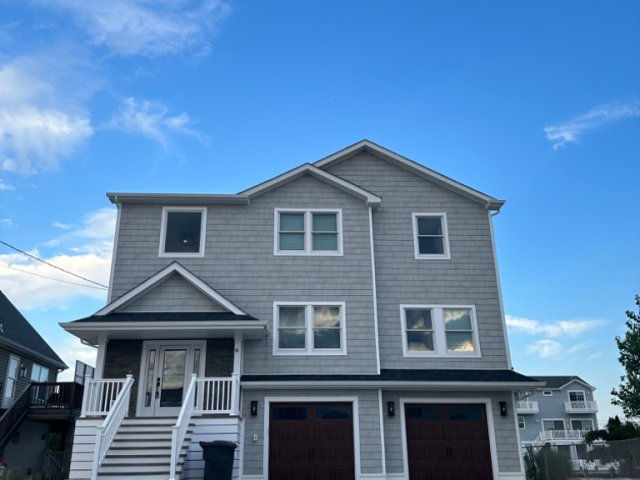 Large new home with pool on lagoon in Beach Haven West